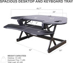 Rocelco 46" Height Adjustable Corner Standing Desk Converter with AC Outlet USB Charger and Anti-Fatigue Floor Mat - Sit Stand Up Tabletop Riser - Keyboard Tray - Black (R CADRB-46-ACUSB-MAFM)